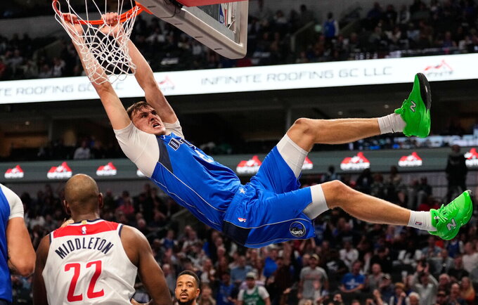 C.Flaggas apšyla kojas NBA (Scanpix nuotr.)