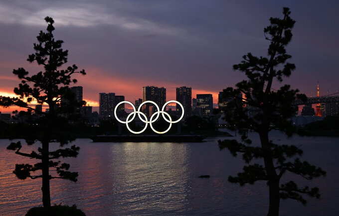 COVID-19 atvejai kelia grėsmę olimpiadai (Scanpix nuotr.)
